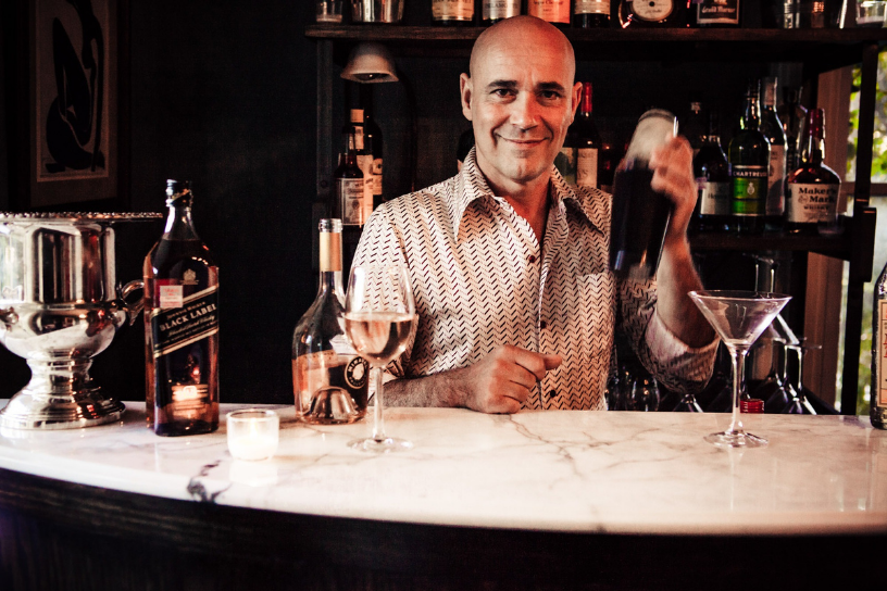 Bartender preparing a cocktail at the marble bar